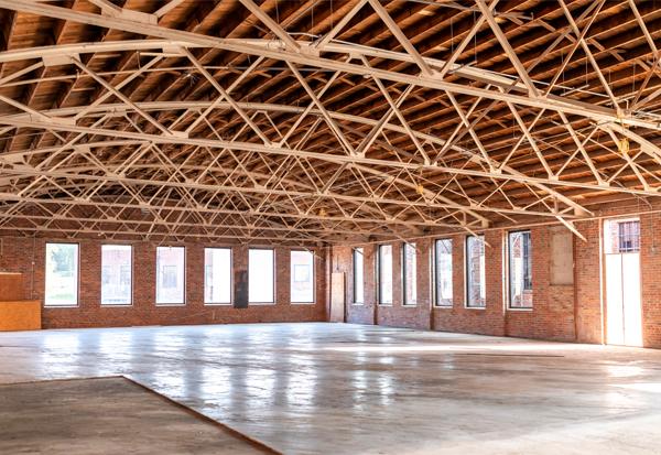 The adaptive reuse, renovation, and restoration of the historic buildings spanned more than five years. Steel grids from existing windows and original bricks were preserved, creating patterns new and old.